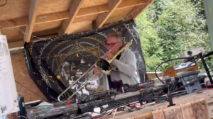 Jack Newhorse playing live ambient trombone at a private outdoor event
